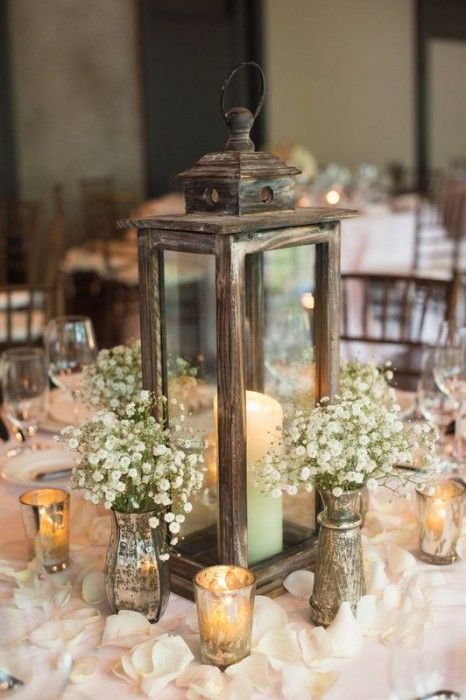 a reclaimed wood candle lantern, baby's breath in mercury glass vases and candles for a cute centerpiece