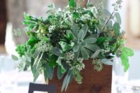 19 a wooden box with herbs, greenery and succulents for a relaxed woodland wedding