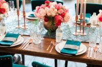 19 teal chairs, napkins and string table runner plus copper vases, flatware and candle holders look wow
