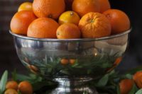 20 a silver bowl with oranges and tangerins for a tropical wedding