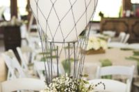 20 hot air balloon centerpiece with neutral florals and a white balloon
