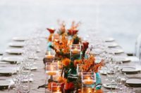 20 teal vases and jars with copper and orange blooms are ideal for a fall table setting