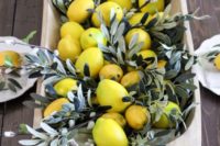 22 a dough bowl with willow pussy branches and lemons for Tuscany wedding