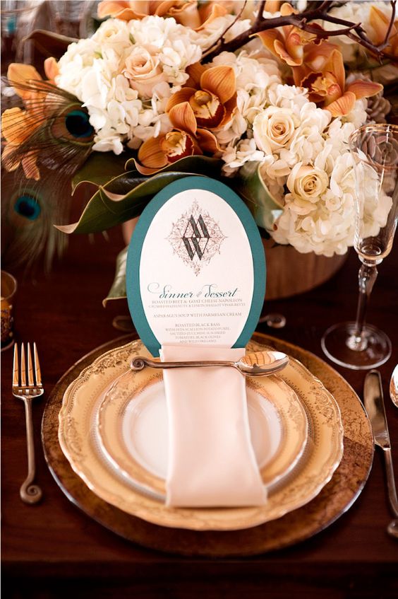 copper flatware, chargers and teal and white wedding menu look refined