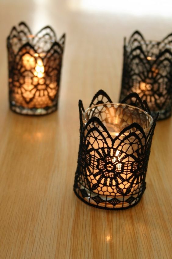glass candle holders covered with black lace will make your table setting more refined and chic