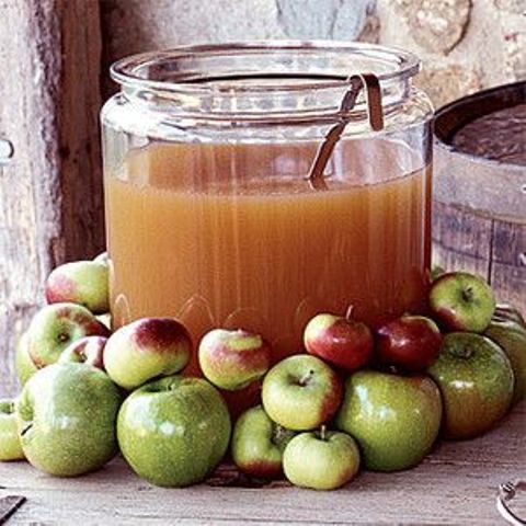 serve apple cider covering the tank with fresh apples to make it clear what's inside
