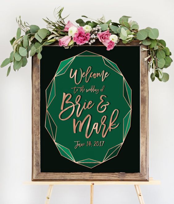 a framed wedding sign with a geometric emerald detail and copper calligraphy