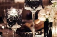 23 glass candle holders with black lace wrapping for an elegant look