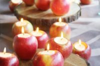 24 apple candle holders on wood slices can be a nice idea for a rustic fall wedding