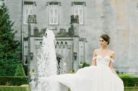 25 a bridal portrait taken in the castle backyard with fountains looks beautiful and relaxed