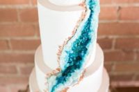 25 a modern wedding cake with copper and teal geode decor is a super trendy idea