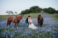 26 newlyweds wandering in the floral fields with horses