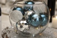 27 a glass bowl with turquoise and silver ornaments for a New Year wedding is easy to compose