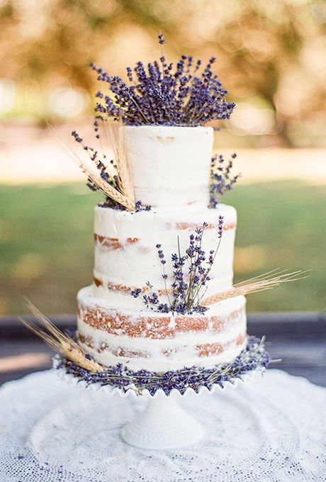 semi naked wedding cake decorated with lavender and wheat looks delicious