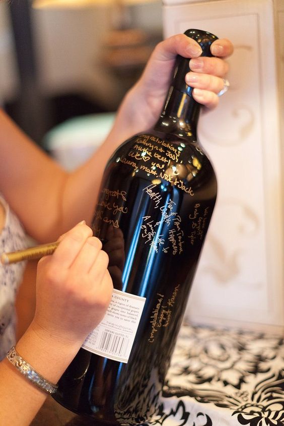 use an oversized champagne bottle as your bachelorette guest book or for wishes