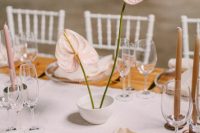 a bowl with anthuriums is a stylish ikebana-styled wedding centerpiece for a minimalist wedding