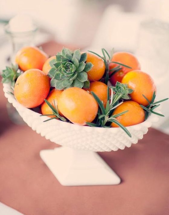a bowl with citrus, succulents and greenery is great for a tropical or southern wedding