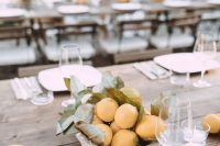 a vintage concrete bowl with lemons and leaves will be a great idea for a Mediterranean wedding