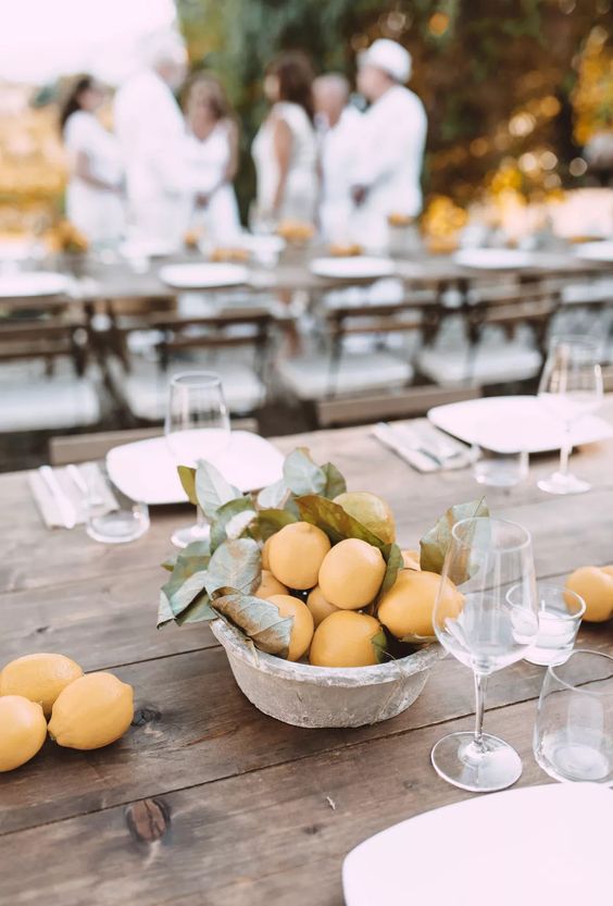 a vintage concrete bowl with lemons and leaves will be a great idea for a Mediterranean wedding