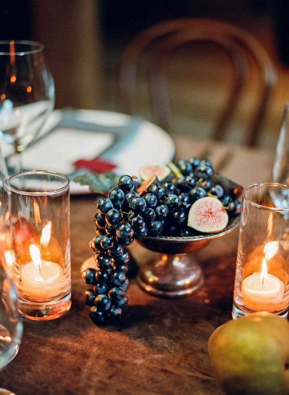 an affordable decadent wedding centerpiece of a bowl with grapes and figs is amazing for a fall wedding