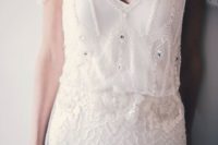 02 a deep V-neckline wedding dress with embroidered cap sleeves and matching beading