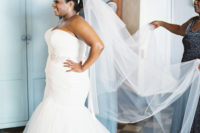 03 The bride chose a strapless mermaid wedding gown with a train, statement earrings and a veil