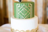 03 a wedding cake with gold scallops, a green layer with gold geo decor and edible feathers