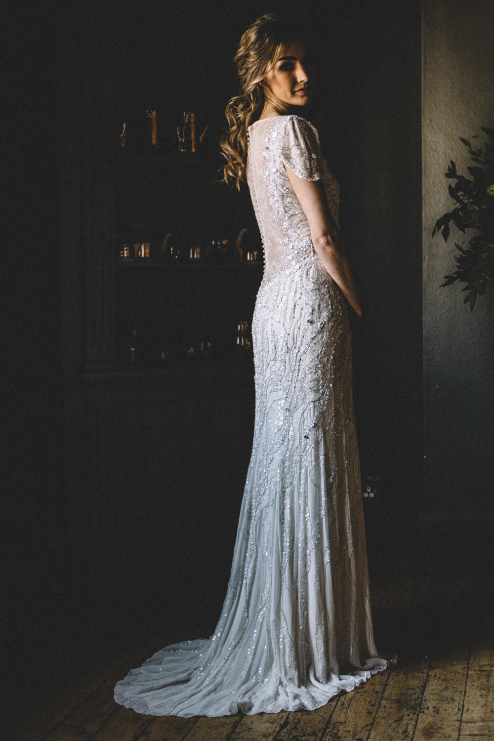 The bride was wearing a Jenny Packham wedding dress with an illusion neckline and back and cap sleeves with a sparkle