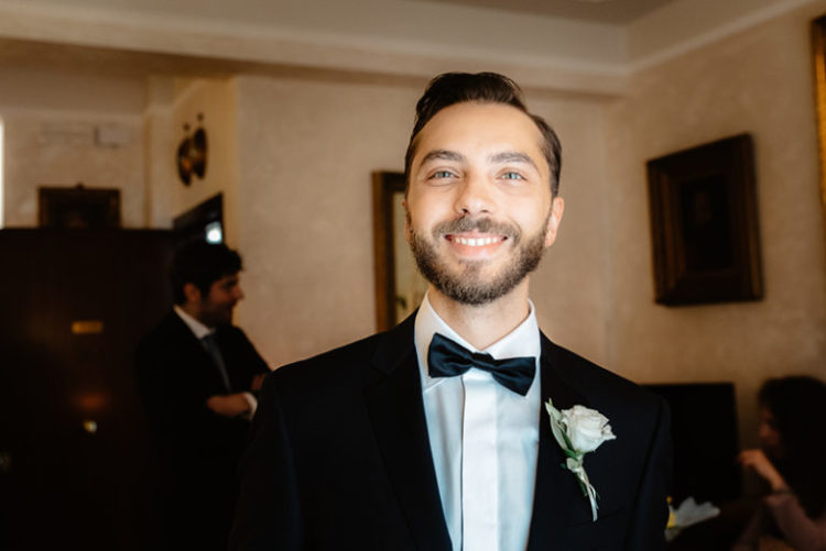 The groom was wearing a classic black tuxedo