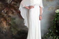 04 a spaghetti strap wedding dress with a sheer cape on top to cover up for a church ceremony