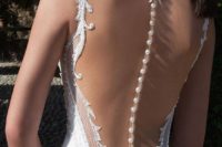 04 mermaid wedding dress with an illusion back and a row of buttons to highlight it