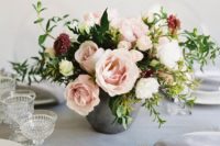 05 a concrete vase with lush blush flowers, greenery and burgundy touches