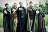 05 groomsmen dressed in elvish style and with green coats over the costumes