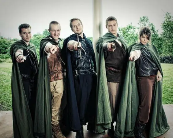 groomsmen dressed in elvish style and with green coats over the costumes