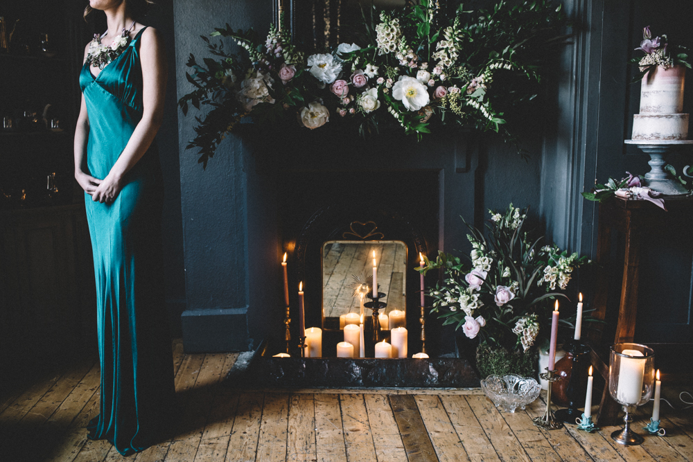 The bridesmaid was rocking a bold emerald dress with straps and a floral necklace