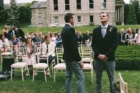 The groom and groomsmen were wearing three-piece suits with pants, waistcoats and black jackets