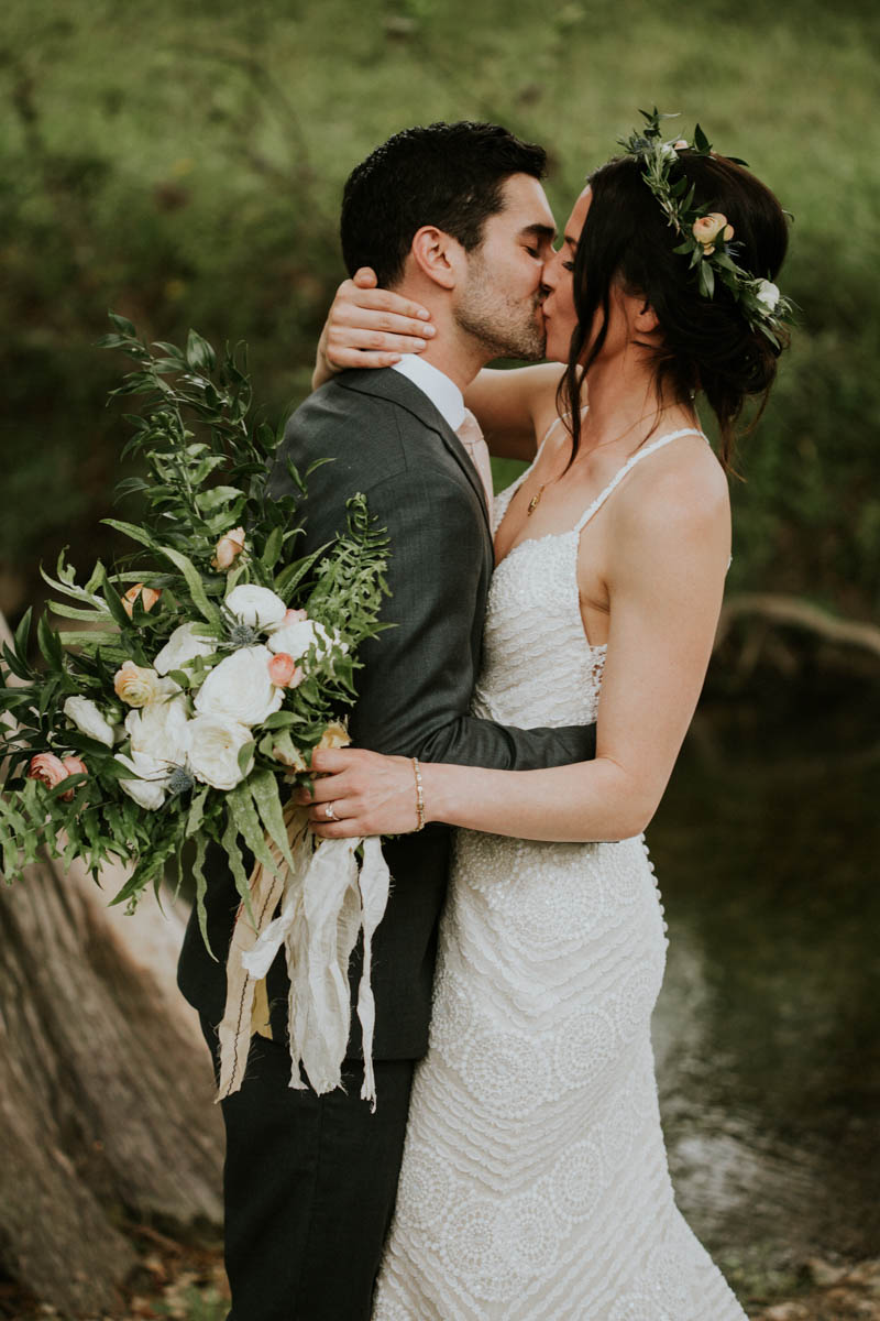 The wedding bouquet was a neutral creamy one with greenery and thistles