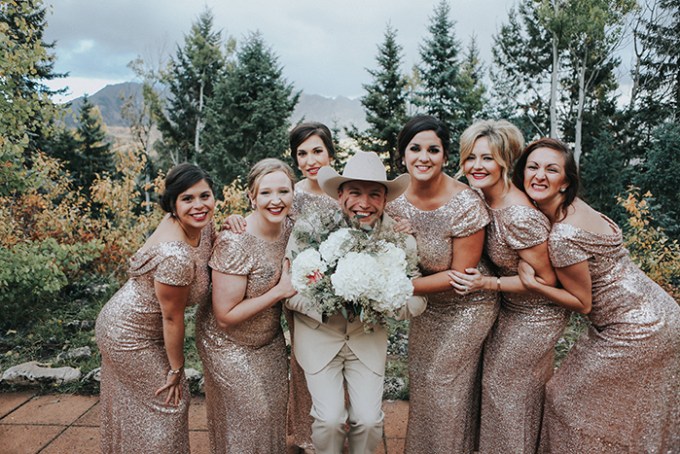 The bridesmaids were wearing rose gold sequin maxi gowns with cap sleeves and hair updos