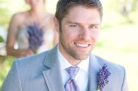 07 the groom wearing a light grey suit with a lavender tie and a lavender boutonniere