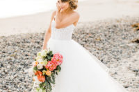 The bride in her Hailey Paige gown with a textural bodice on spaghetti straps and a layered tulle skirt