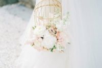 09 a gilded cage with lush white and blush blooms looks heavenly beautiful