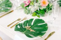 10 add tropical leaves to each place setting to highlight your wedding scheme