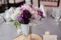 12 a chic floral arrangement with blush, white and purple blooms in a silver vase