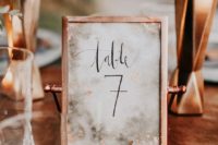 12 a copper frame for a table number is a great choice for any kind of wedding