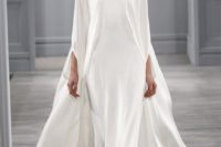 13 a minimalist spaghetti strap wedding dress and a cape over it for a statement