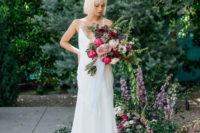 15 a minimalist wedding dress on spaghetti straps with a plunging neckline and a low back