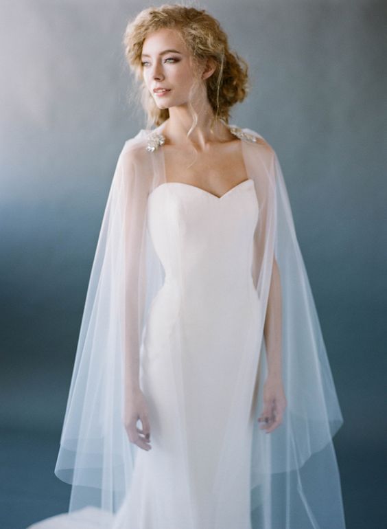 a sheer veil that doubles as a cape is needed   choose what you like more and wear it accordingly