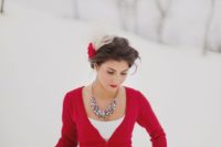 17 a hot red cardigan, a statement necklace and red lips are all you need to accessorize a simple wedding dress