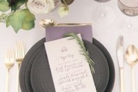 17 a lavender napkin echoes with the blooms in the arrangement and dark grey plates contrast them