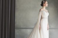 17 a stylish jeweled cape perfectly fits the wedding dress detailing